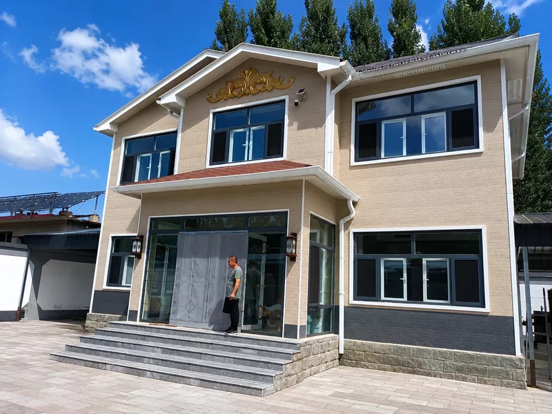 Modern villa exterior with decorative metal siding panels Modern villa exterior with decorative metal siding panels